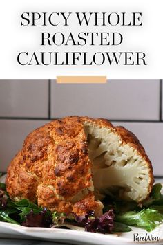 a plate with cauliflower on it and the words spicy whole roasted cauliflower