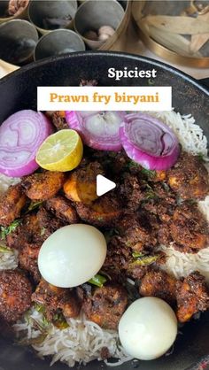 a pan filled with rice, meat and onions