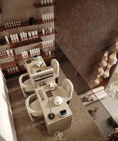 an aerial view of a dining table and chairs in a room with many bottles on the wall