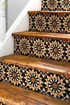 the stairs are decorated with black and white tiles