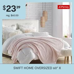 a bed with a pink blanket and pillows on it for $ 23 99 reg $ 60 00