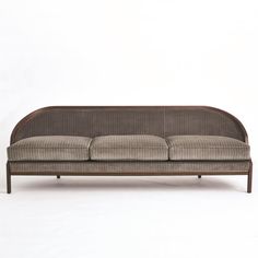 Tailored Sofa is distinguished by the sleek pinstripe fabric around the back support. A beautiful wooden base supports the sofa and is accentuated along the bottom edge with a filet of solid brass running around the entire frame of the sofa. Elegant shapely legs and frame are finished in a dark waxed oiled walnut finish. Dimensions Overall 95.75"W x 32"H x 28.75"D (130 lbs) Leg 7.25"H  Weight Limit - 300 lbs per seat (900 lbs total) Solid Beech Brass Trim 33% Polester, 51% Cotton, 16% Acrylic  F Global Views Furniture, Sofa Elegant, Pinstripe Fabric, Unique Sofas, Brown Pinstripe, Dark Wax, Global Views, Brown Sofa, Wooden Base