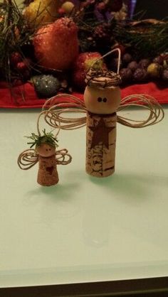 a cork angel with a straw hat on it