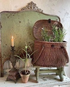 a wicker basket sitting on top of a white mantle next to a potted plant