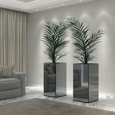 a living room filled with furniture and a plant in tall vases next to a couch