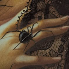 a drawing of a hand holding a black spider