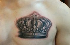 a man with a crown tattoo on his chest