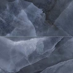 an abstract photo of mountains and clouds in gray tones with white border around the edges