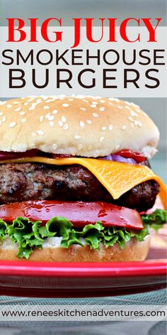 a hamburger with lettuce, tomato and cheese on it sitting on a red plate