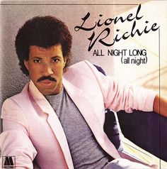 an album cover with a man in a pink jacket