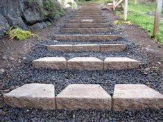 stone steps leading up to the top of a hill