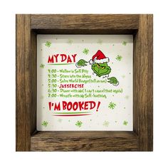 a wooden frame with an image of a griny grin on it and the words, my day i'm booked