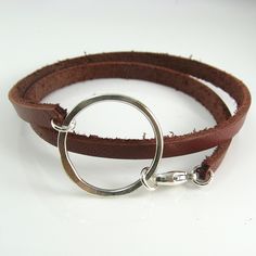 A chunky leather double wrap bracelet with a handcrafted circle centerpiece is ruggedly dainty. The leather is 5mm wide and 2mm thick and the sterling silver centerpiece measures about 1-1/4 inches (3 cm) wide. All held together with a sterling silver lobster clasp. Leather is available in Black, Brown, White and Dark Red-Brown.Please measure your wrist to find the best size for you. Add length based on whether you prefer a looser or tighter fit and select the size that best corresponds to your Leather Belt Crafts, Leather Bracelet Tutorial, Leather Cord Jewelry, Diy Leather Bracelet, Hardware Jewelry, Leather Jewellery, Brown Leather Bracelet, Double Wrap Bracelet, Cord Jewelry