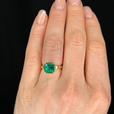 3 Carat Emerald Cocktail Ring in 18k Yellow Gold. This custom made emerald cut solitaire is set with a 3.45 carat emerald in 14 karat yellow gold. This repurposed emerald is truly exceptional, featuring a rich blue/green hue with high transparency. Set in a simple solitaire in a four (4) prong basket this emerald cut square emerald is beautifully complemented by the high polish yellow gold custom made setting. Radiant Cut Emerald Ring Luxury, Luxury Emerald Ring With Radiant Cut, Gold Emerald Ring With Radiant Cut, Gold Radiant Cut Emerald Rings, Princess Cut Emerald Ring In Yellow Gold, Radiant Cut Yellow Gold Emerald Ring, Asscher Cut Solitaire Emerald Ring In Yellow Gold, Luxury Yellow Gold Emerald Cut Ring, Luxury Yellow Gold Emerald Ring With Square Cut