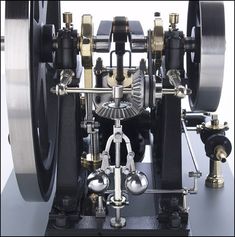 a close up of a clock with metal parts