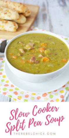 a bowl of slow cooker split pea soup on a table with crackers in the background