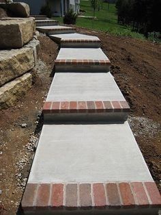 some steps made out of bricks in the dirt