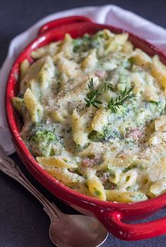 creamy broccoli bacon pasta casserole in a red bowl