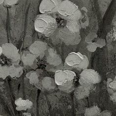 black and white photograph of flowers on the ground with watercolor paint overlaying them