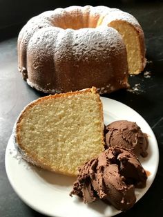 a bundt cake with chocolate ice cream on a white plate next to the bundt cake