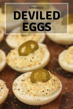 smoked deviled eggs with pickles on top and text overlay that reads smoked deviled eggs