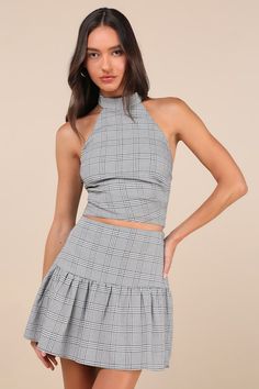 Compose a look that's sure to get you endless compliments with the Lulus Trendy Momentum Black and White Plaid Mini Skirt! Lightweight woven fabric boasts a plaid, houndstooth-style pattern as it shapes this cute skirt that has a high waist and a ruffled, lightly flaring panel that falls to a mini hem. Hidden zipper/clasp at side. Pair with the matching top for a complete look! Fit: This garment fits true to size. Length: Mid-thigh. Size medium measures 16.5" from waist to hem. Waist: Fitted - v Spring Fitted Plaid Skort, Fitted Plaid Mini Skort, Fitted Plaid Mini Skirt For Spring, Chic Fitted Houndstooth Skirt, Chic Fitted Plaid Skirt, Fitted Gingham Mini Skirt, Fitted Gingham Skirt With Lining, Fitted Gingham Lined Skirt, Fitted Gingham Tiered Skirt