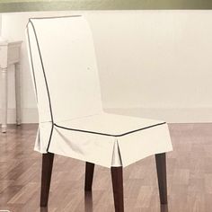 a white chair sitting on top of a hard wood floor