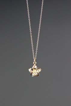 "A sweet and delicate 18k gold vermeil Plumeria flower charm simply dangles from a 14k gold filled chain. Choose from a 1mm 14k gold filled chain with a gold spring ring clasp, or a 1.5mm 14k gold filled chain with a gold lobster clasp. Each chain measures 16\" with an extension to 18\".  Please send a message if a different length chain is desired. This small and lightweight go-with-everything necklace completes any outfit for daytime or evening.   Gold flower charm: 12x11mm Total length of cha Plumeria Flower Necklace, Everyday Gold Jewelry In Flower Shape, Delicate Flower-shaped Everyday Jewelry, Delicate Flower Shaped Everyday Jewelry, Delicate Yellow Gold Jewelry With Flower Charm, Dainty Yellow Gold Flower Jewelry, Delicate Everyday Flower Shaped Jewelry, Flower Gold Necklace, Gold Flower Shaped Necklace For Everyday