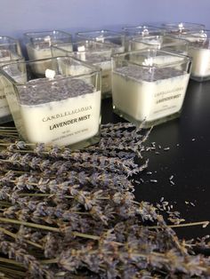 lavenders and candles are arranged on a table