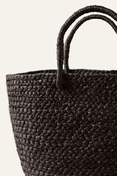 The perfect every-day bag, our Braided Raffia Day Bag is skillfully crafted by our female artisan partners in Rwanda. 16" W x 5" D x 10" H (4" Handle Drop) Black hand-dyed fibers Made from locally sourced natural braided raffia Unlined interior and sturdy handles This lightweight handbag pairs nicely with a sundress and is the perfect size to hold all of your necessities! Impact The artisan sector is the second largest employer in the developing world. Yet the majority of artisans are women who Natural Bag With Rolled Handles, Natural Color Satchel With Rolled Handles, Natural Satchel With Rolled Handles For Everyday, Handwoven Double Handle Bag For Daily Use, Black Handwoven Double Handle Bags, Daily Use Handwoven Bag With Double Handle, Daily Use Handwoven Double Handle Bags, Handwoven Top Handle Bags For Everyday Use, Eco-friendly Everyday Bags With Braided Handles