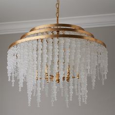 a chandelier hanging from the ceiling in a room