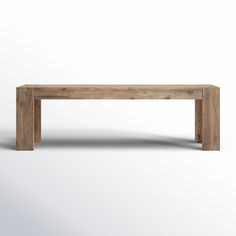 a wooden bench sitting on top of a white floor