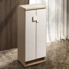 a white cabinet sitting on top of a carpeted floor next to a window with curtains