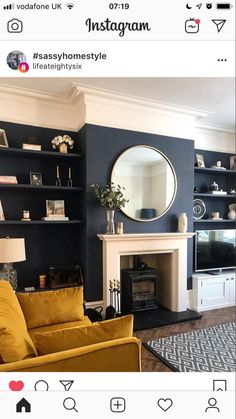 a living room with blue walls and yellow furniture