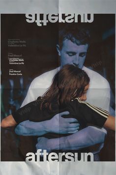 an advertisement for the movie aftersun featuring two people hugging each other in front of a black and white background