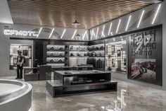 a man standing in front of a display case