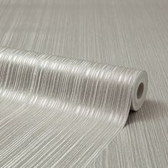 a roll of silver metallic foil on top of a table