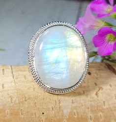 "Natural Premium AAAA Grade Oval Rainbow Moonstone .925 Sterling Silver Ring Size 9.50 11 Grams 1\" x 7/8\" FG34. Lots of blue and orange color flash! This is a handpicked natural stone, the exact one shown in picture.  The sterling silver is .925 and stamped.  Each piece is hand made by artisans in my shop.  The quality of the stones and the silver workmanship is impressive.  Please look at other items in my store.  I sell ready made jewelry with hand crafted silver work, pendants with a sterling silver bails and beautiful unique cabochons for jewelry wire wrapping and weaving. You will pay exact amount on shipping plus $1 for supplies and labor. All items are shipped within a couple of days after payment and are shipped USPS first class or international first class.  Items are available Oval Moonstone Spiritual Ring, Oval Moonstone Healing Ring, Oval Spiritual Moonstone Ring, Mystical Oval Moonstone Ring Gift, Spiritual Oval Moonstone Ring With Natural Stones, Large Moonstone Spiritual Ring, Moon Shaped Moonstone Ring With Natural Stones, Mystical Oval Moonstone Crystal Ring, Spiritual Moonstone Cabochon Ring For Anniversary