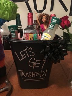 a plastic trash can filled with lots of bottles and knick - knacks