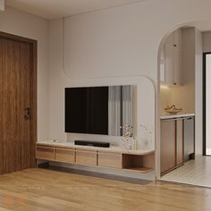 an empty living room with a flat screen tv on the wall and wooden flooring