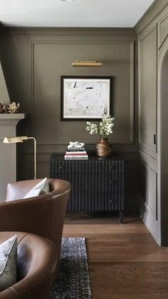 a living room with green walls and furniture