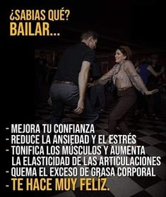 a man and woman dancing in the middle of a dance floor with words written on it