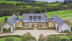 an aerial view of a house in the countryside