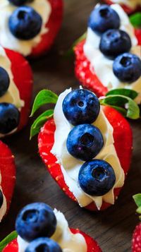 strawberries and blueberries are arranged on top of each other