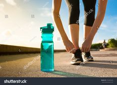 Woman tying her shoe next to bottle of water. Focus on bottle. #Ad , #spon, #shoe#tying#Woman#Focus Homemade Electrolytes, Homemade Electrolyte Drink, Electrolyte Water, Health Maintenance, Benefits Of Drinking Water, Healing Tea, Healthy Hydration, Electrolyte Drink, Runners World