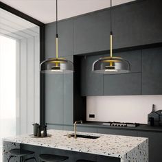 a kitchen with two pendant lights hanging over the island and bar stools next to it