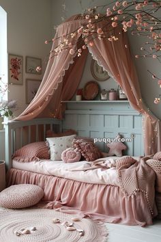 a bed with pink sheets and pillows in a room