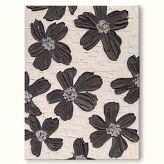 black and white flowers are on the wall