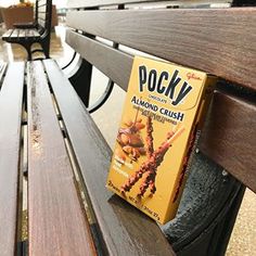 a book sitting on top of a wooden bench