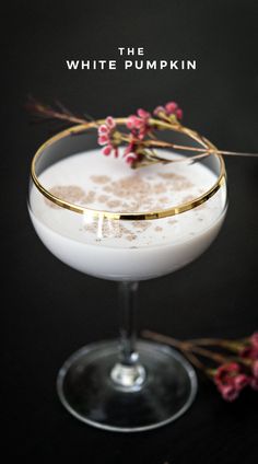 the white pumpkin cocktail is garnished with flowers